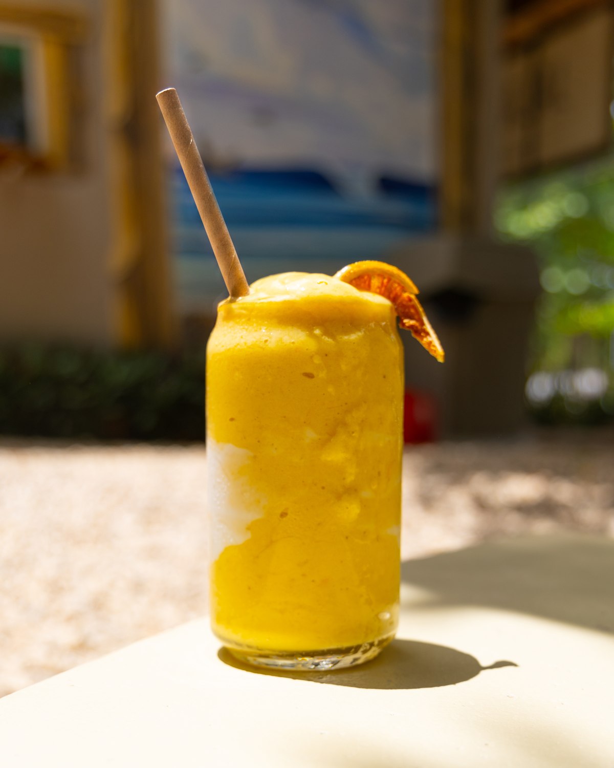 A cold mango drink in the sun
