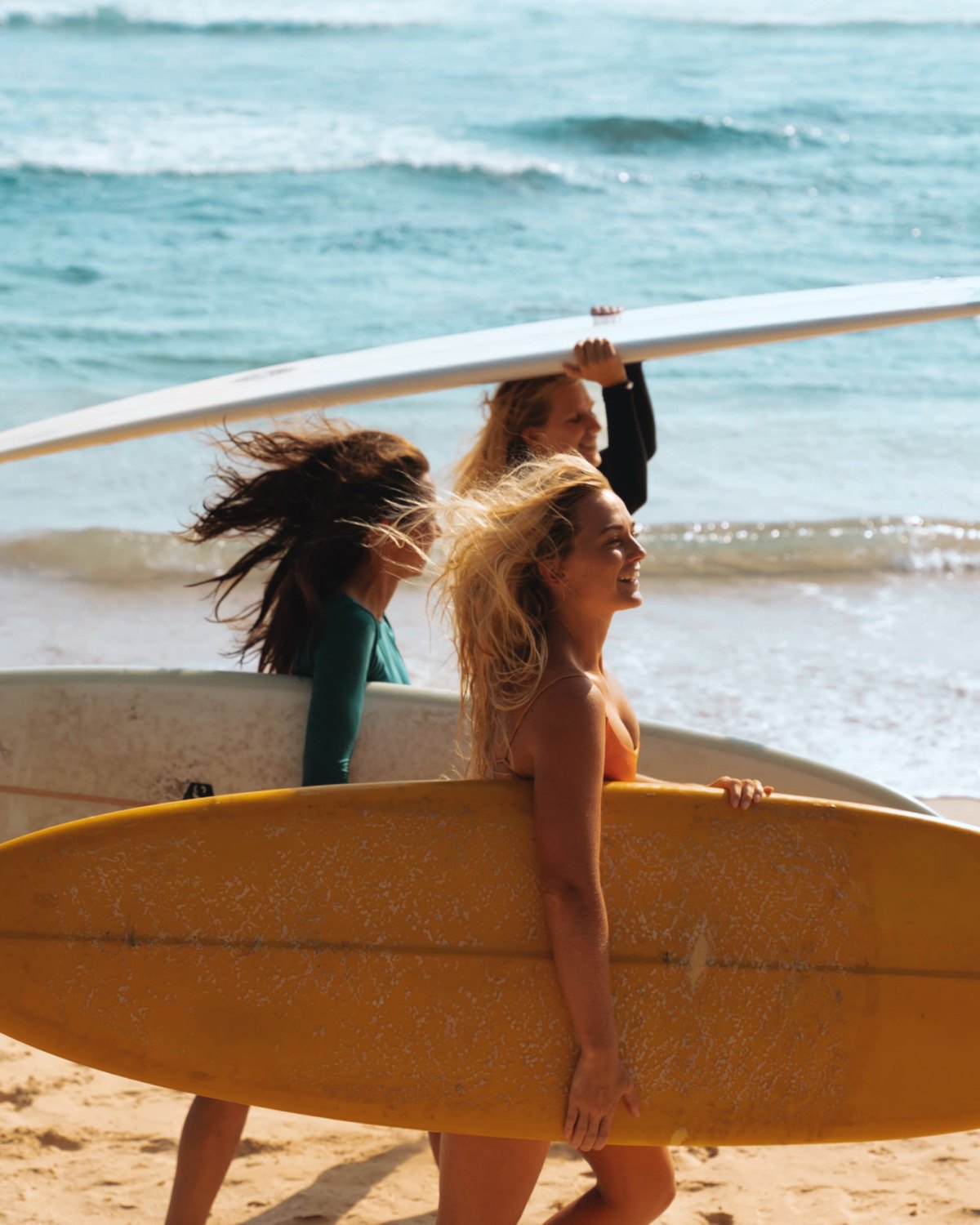 Surfers walking to a Guanacaste break at first light